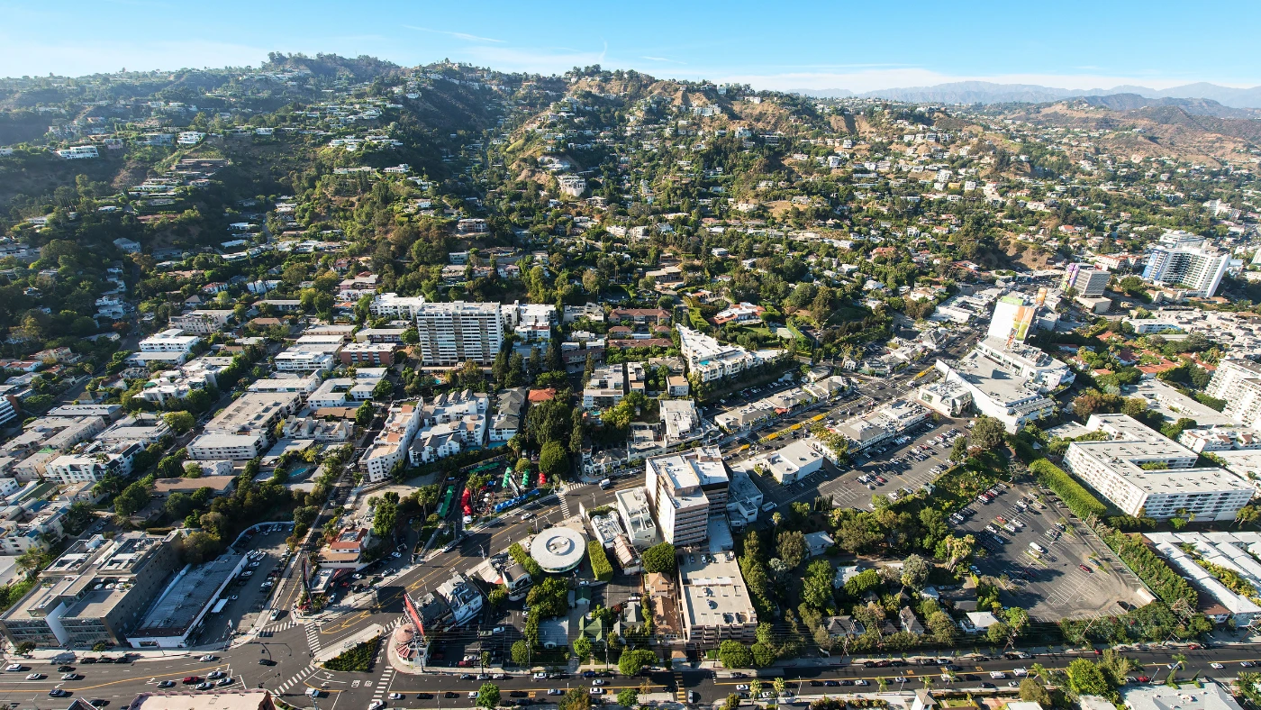 Aerial view over West Hollywood, with the Sunset Strip in the foreground and hillside homes rising behind
