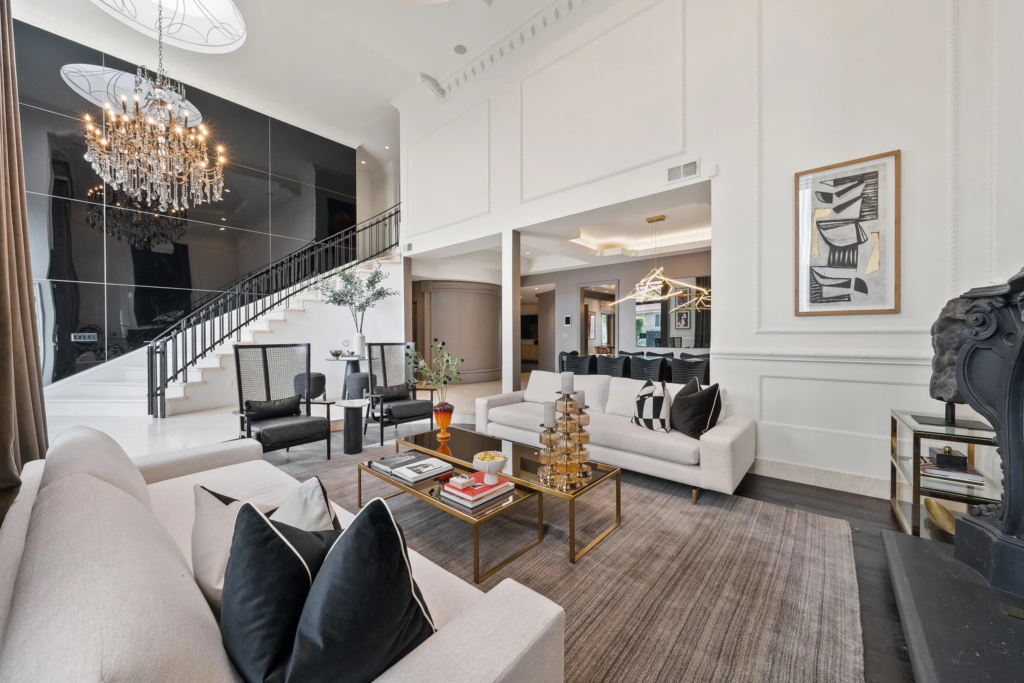 Grand crystal chandelier and sculptural staircase anchoring the open main lounge