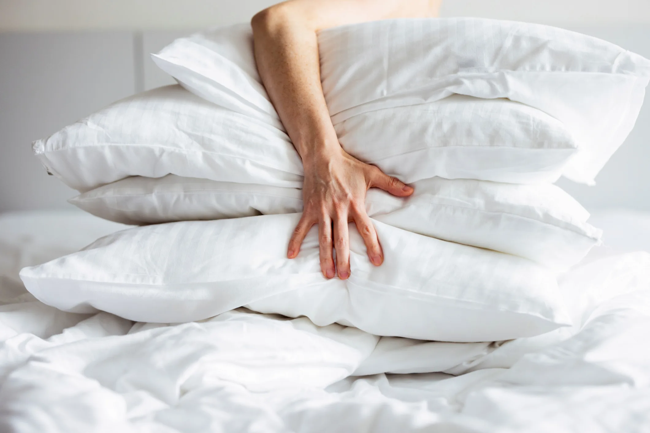 Guest relaxing with premium pillows as part of a personalized pillow menu at a luxury Los Angeles villa