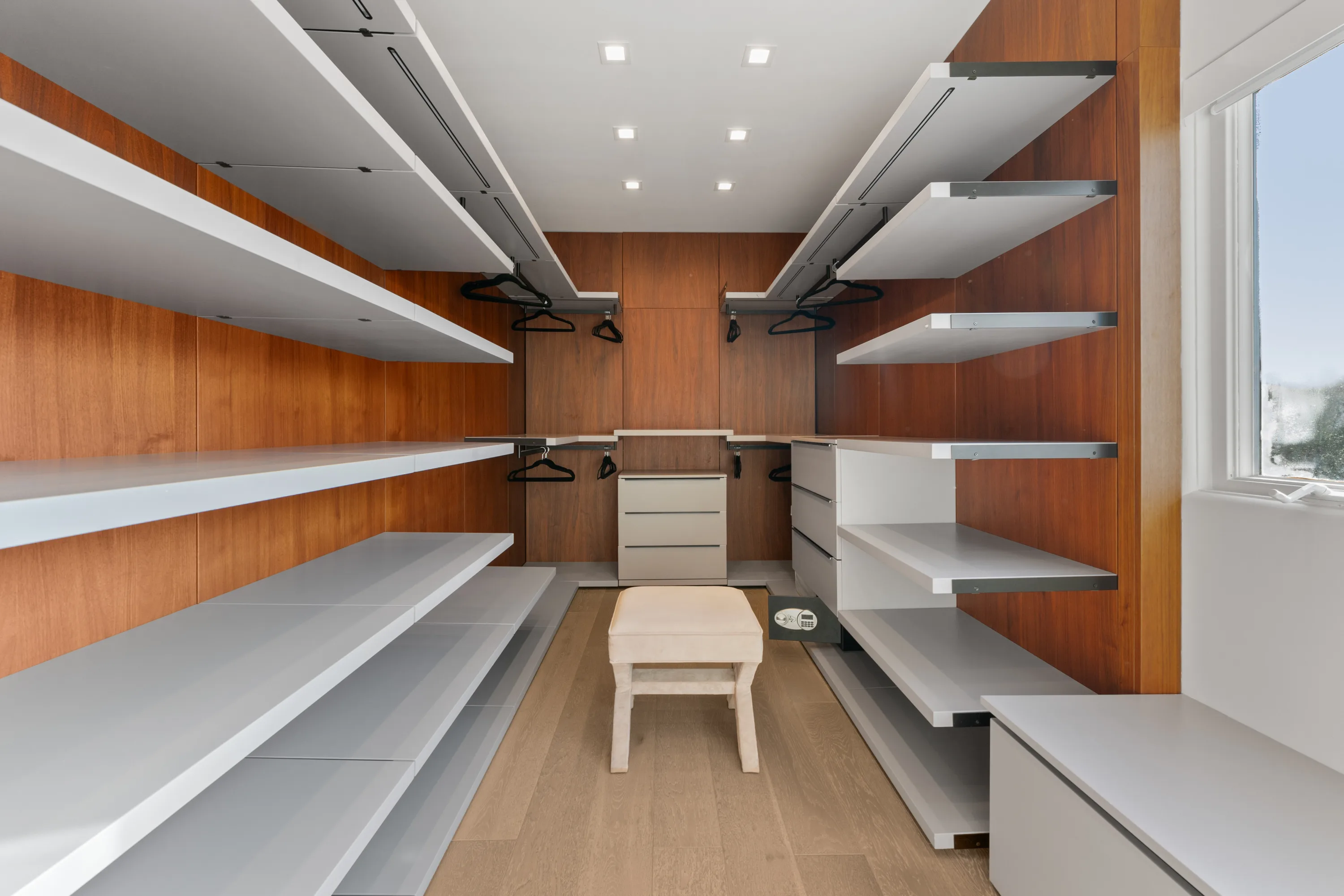 Spacious walk-in closet at Rodeo Villa, a luxury Beverly Hills vacation rental featuring custom storage, modern finishes, and an elegant dressing area.