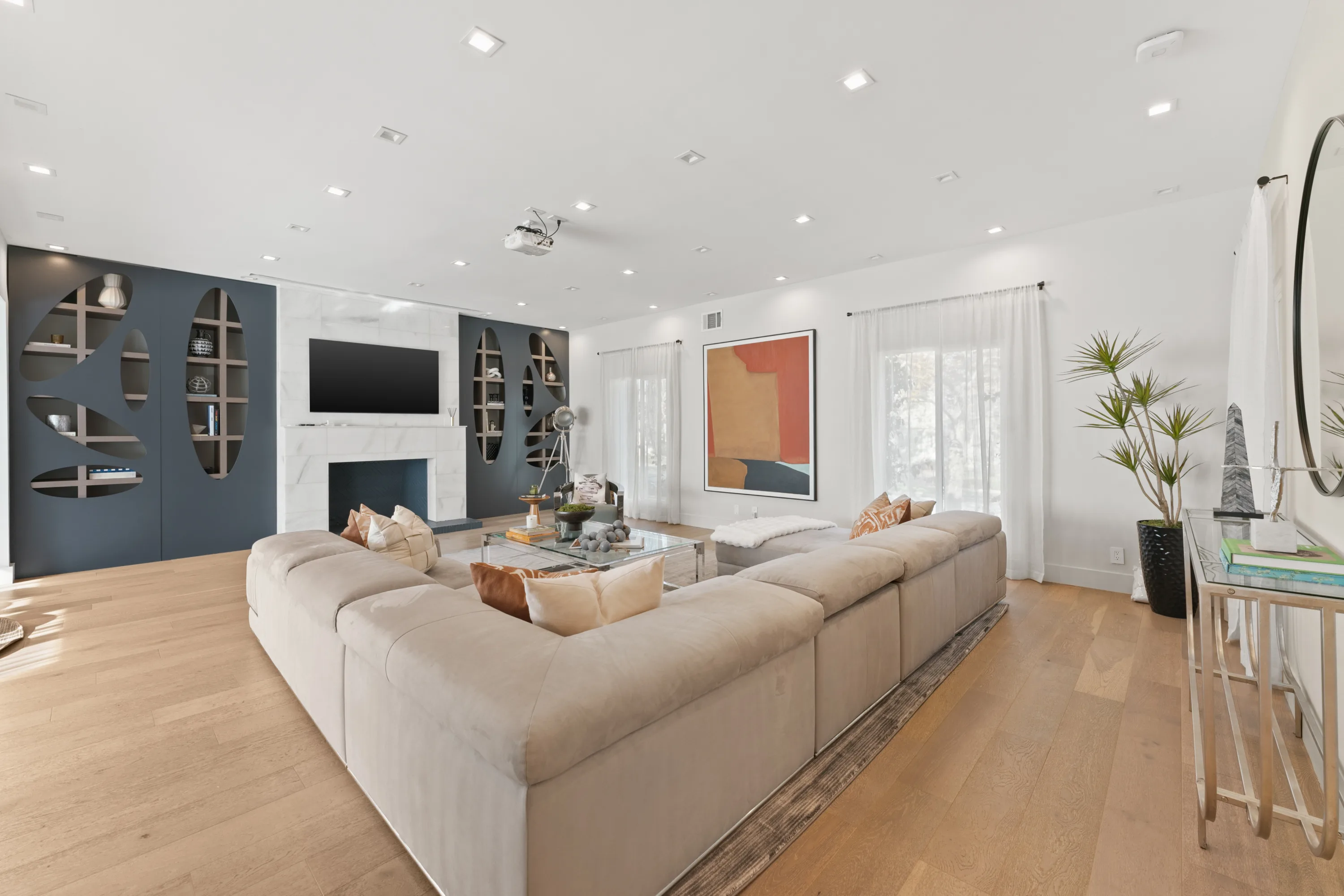 Bright, open-concept living room at Rodeo Villa, a luxury Beverly Hills vacation rental featuring modern furnishings, elegant interiors, and poolside views.