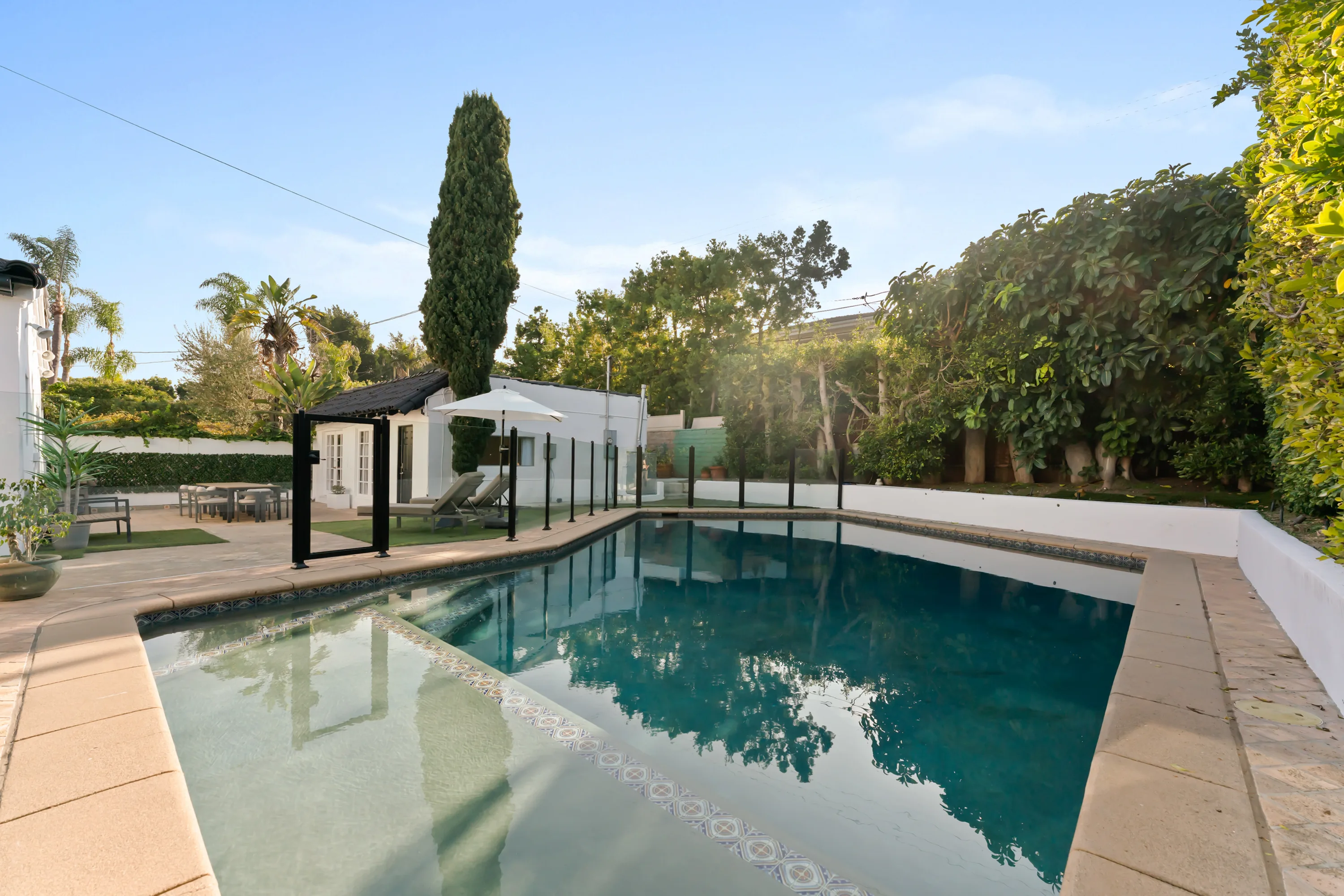 Swimming pool at Rodeo Villa, a luxury Beverly Hills vacation rental featuring a private outdoor setting, lounge space, and elevated indoor-outdoor living.