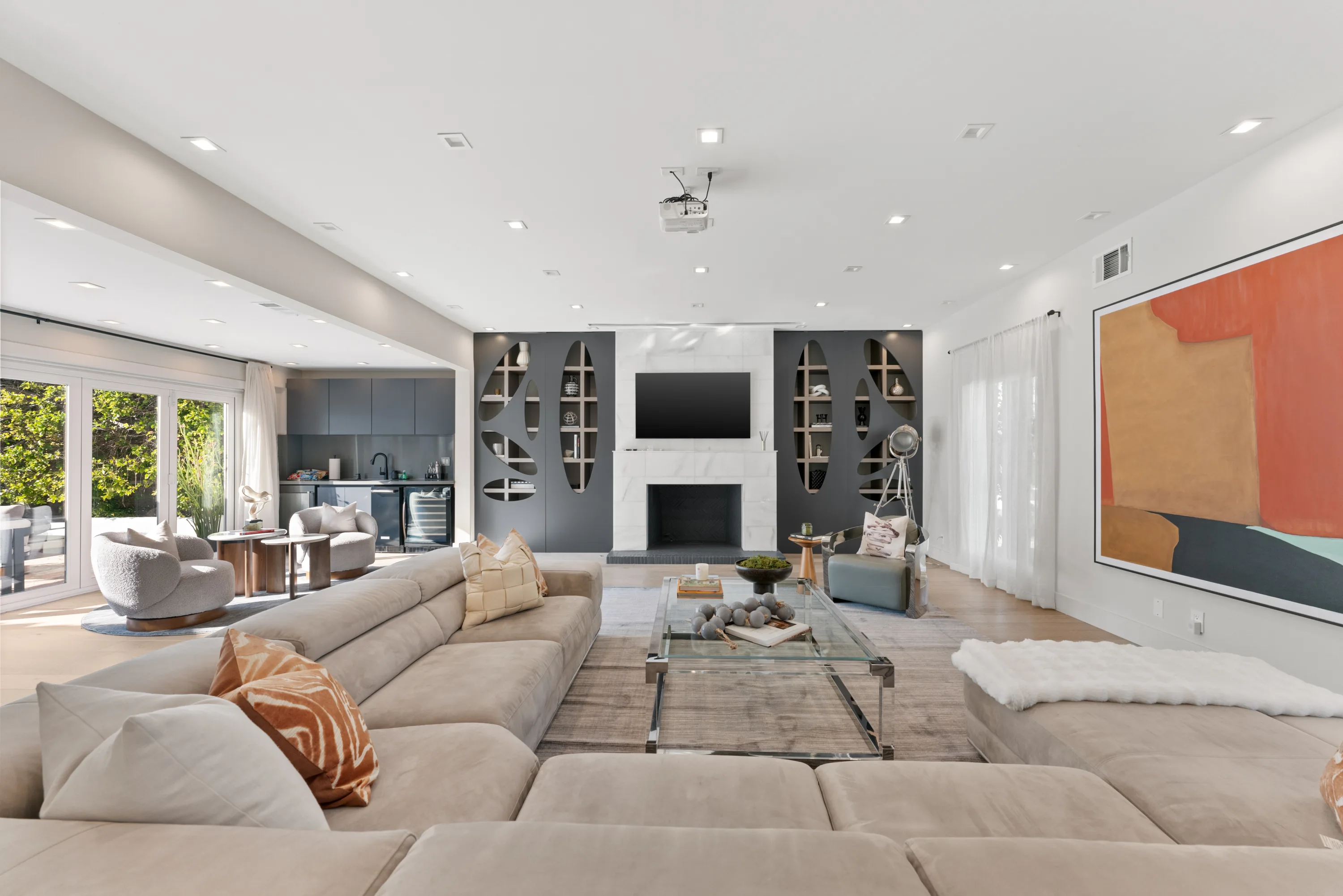 Bright, open-concept living room at Rodeo Villa, a luxury Beverly Hills vacation rental featuring modern furnishings, elegant interiors, and poolside views.