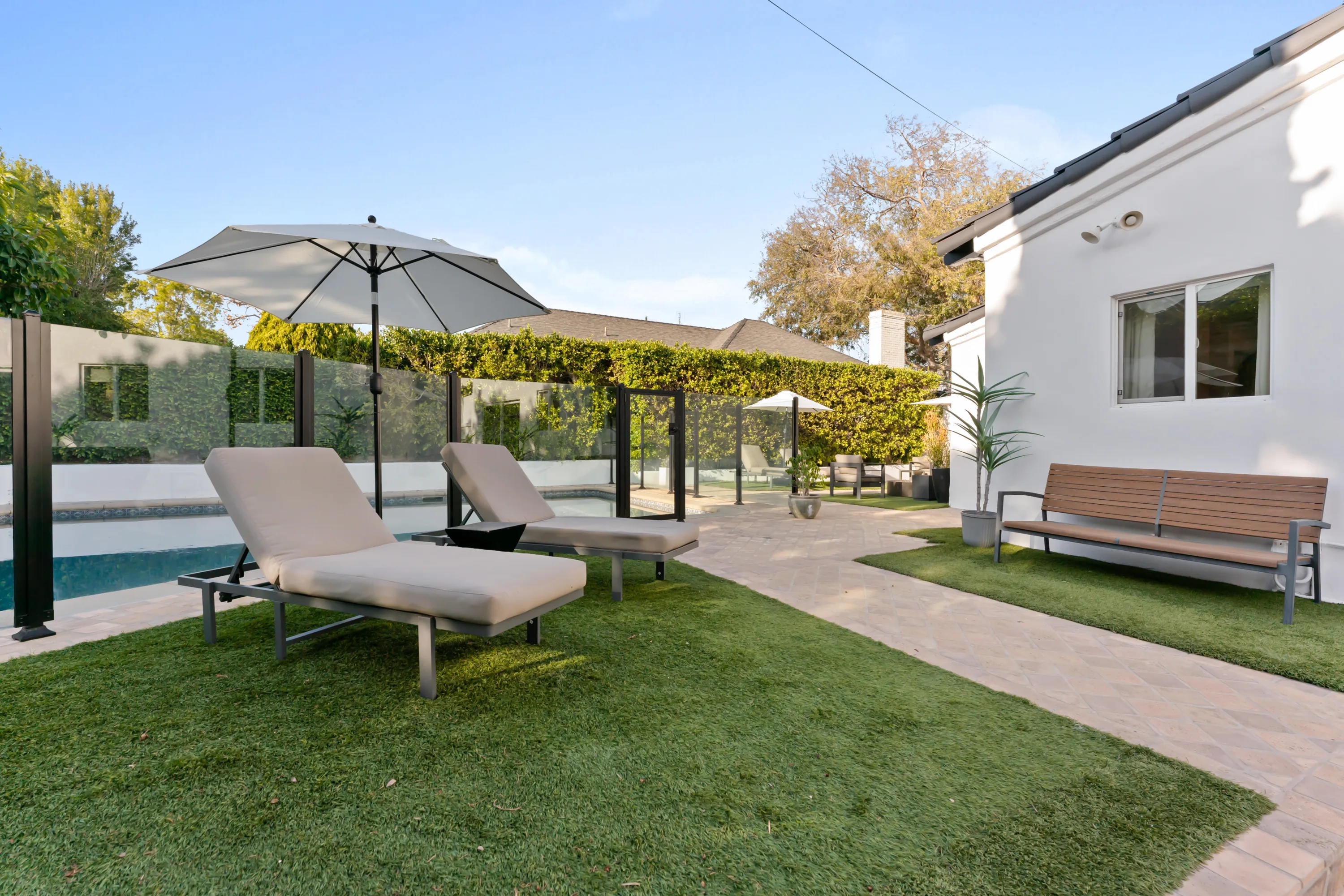 pool at Rodeo Villa, a luxury Beverly Hills vacation rental featuring a private outdoor setting, lounge space, and elevated indoor-outdoor living.
