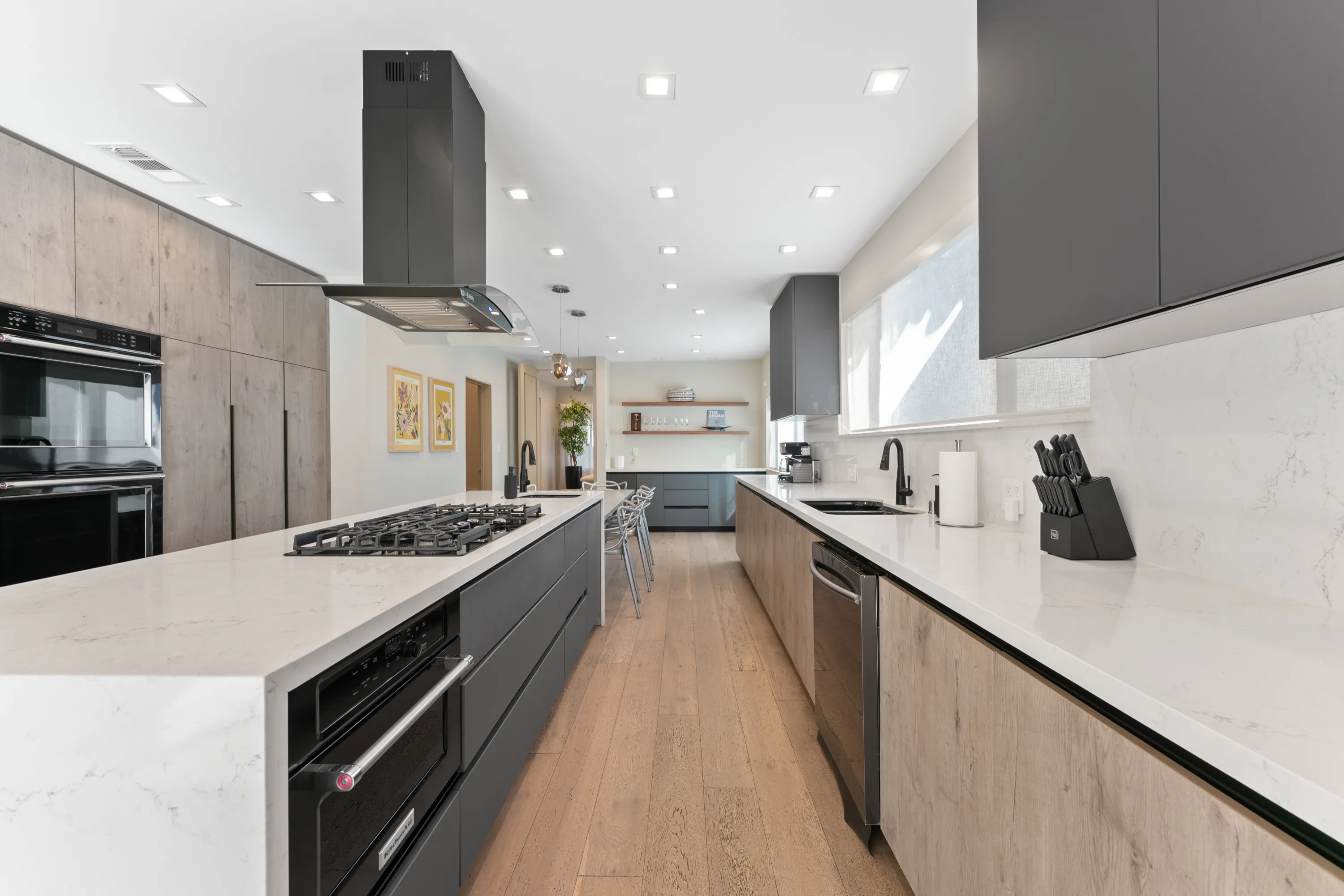 Modern chef's kitchen at Rodeo Villa, a luxury Beverly Hills vacation rental featuring a spacious marble island, premium appliances, and sleek cabinetry.